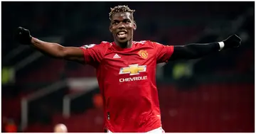 Paul Pogba celebrates assisting his team's second goal during a Premier League match between Man United and Brighton. Photo by Ash Donelon.