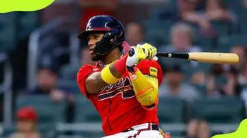 Ronald Acuña Jr. of the Atlanta Braves hits a single during the first inning against the Washington Nationals at Truist Park