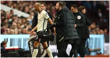 Fabinho leaves the field through injury during the Premier League match between Aston Villa and Liverpool at Villa Park. Photo by Chris Brunskill.