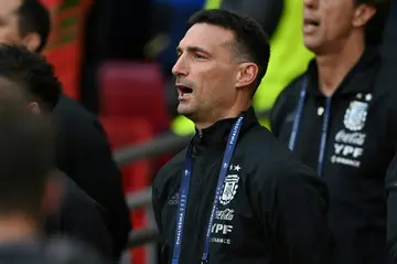 Argentina's head coach Lionel Scaloni sings the anthem ahead of the 'Finalissima' International friendly football match between Italy and Argentina in London