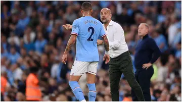 Pep Guardiola speaks to Kyle Walker during the Premier League match between Manchester City and Nottingham Forest at Etihad Stadium. Photo by Laurence Griffiths.