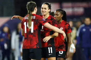 Canada players celebrate after defeating Costa Rica 1-0 in extra time to advance to the semi-finals of the CONCACAF Women's Gold Cup