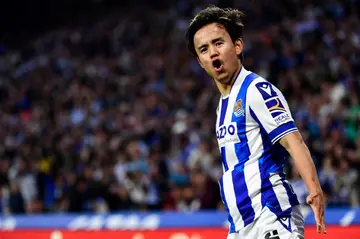 Real Sociedad's Japanese winger Takefusa Kubo celebrates after scoring against Almeria to take his team to the brink of Europe