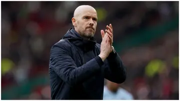 Erik ten Hag applauds fans after Man United's Premier League match at Old Trafford. Photo by Martin Rickett.