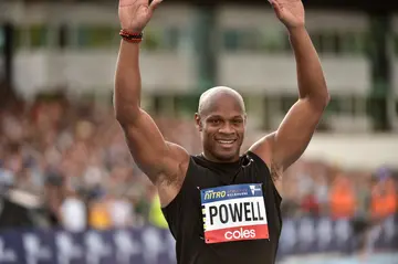 Asafa Powell of Bolt All-Stars celebrates winning the 60m Sprint at Nitro Athletics