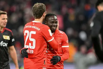 Bayern Munich forward Thomas Mueller embraces teammate Sadio Mane. The two will be crucial up front in Bayern's home clash with Paris Saint-Germain on Wednesday