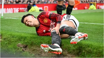  Lisandro Martinez goes down with an injury during the Premier League match between Manchester United and West Ham United. Photo by Michael Regan.