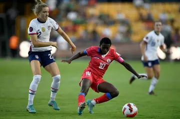 The United States' Kristie Mewis (L) vies for the ball with Haiti's Nerilia Mondesir during the CONCACAF W tournament in Monterrey, Mexico