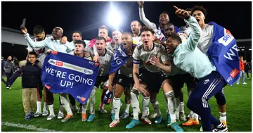 Fulham players celebrate their side's promotion to the Premier League following victory in the Sky Bet Championship match between Fulham and Preston North End. Photo by Clive Rose.