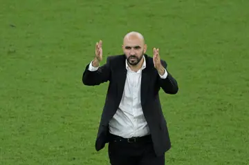 Morocco coach Walid Regragui celebrates his team's quarter-final upset of Portugal