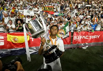 Brazilian forward Rodrygo holds the Copa del Rey trophy after helping Real Madrid beat Osasuna