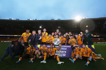 Wolverhampton Wanderers players lift the trophy after the team win during the Premier League 2 Play-Off Final match between Wolverhampton Wanderers and Stoke City at Molineux