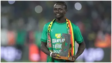 Sadio Mane poses with the Player of the Tournament award after winning the Africa Cup of Nations 2021 with Senegal.