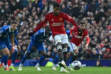 Spot on: Marcus Rashford (centre) scored Manchester United's second goal against Everton