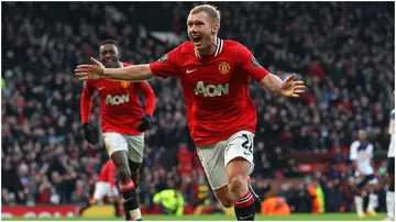 Paul Scholes celebrates after scoring during the Premier League match between Manchester United and Bolton Wanderers at Old Trafford in 2012. Photo by Alex Livesey.
