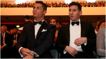 Cristiano Ronaldo sits with Lionel Messi during the FIFA Ballon d'Or Gala 2015 at the Kongresshaus in Zurich. Photo by Alexander Hassenstein.