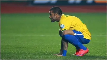 Dani Alves looks dejected after the penalty shootout during the 2015 Copa America Chile quarter-final match between Brazil and Paraguay. Photo by Hector Vivas.