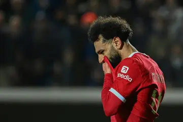 Tough night: Liverpool's Mohamed Salah scored from the penalty spot but his team were knocked out of the Europa League by Atalanta