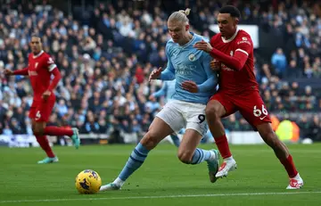 Erling Haaland (left) has hit back at Trent Alexander-Arnold's (right) claim that trophies mean more to Liverpool