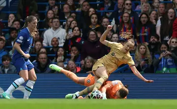 Chelsea goalkeeper Ann-Katrin Berger saves from Barcelona's Norwegian forward Caroline Graham Hansen in the first leg at Stamford Bridge