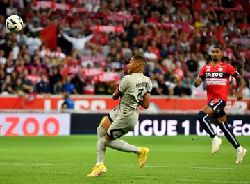 In full flight: Kylian Mbappe scoring after eight seconds in Lille