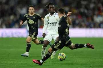 Thriving: Real Madrid's French midfielder Eduardo Camavinga (C) vies for the ball in the win over Celta Vigo