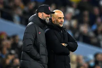 Rival bosses - Liverpool manager Jurgen Klopp (L) and Manchester City counterpart Pep Guardiola on the Etihad touchline