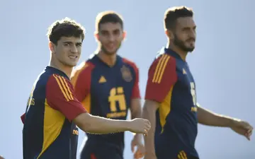 Spain's midfielder Gavi (L) arrives to a training session on the eve of the UEFA Nations League clash between Portugal and Spain