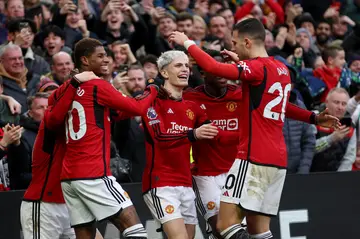 Manchester United players celebrate after scoring their second goal during the Premier League match against West Ham United 