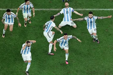 Lionel Messi (2nd R) celebrates after winning the World Cup with Argentina