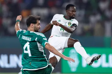 Mohamed Dellah Yaly scores for Mauritania in a shock Africa Cup of Nations victory over Algeria.