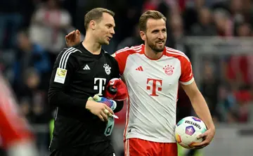 Bayern Munich striker Harry Kane (r.) took home the matchball after scoring three goals in his side's 8-0 thrashing of Darmstadt on Saturday