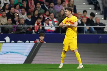 Barcelona forward Robert Lewandowski celebrates scoring his team's second goal in the rout of Atletico Madrid