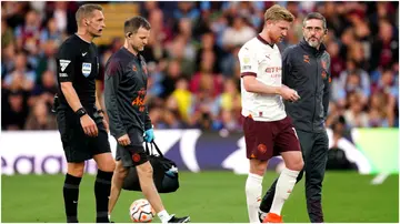 Kevin De Bruyne appears dejected after being substituted off for an injury during the Premier League match at Turf Moor. Photo by Mike Egerton.