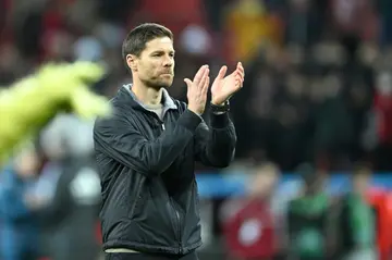 Bayer Leverkusen coach Xabi Alonso said it was "too early" to talk of a title for his side