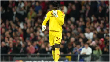 Andre Onana looks dejected after the final whistle in the UEFA Champions League Group A match at Old Trafford. Photo by Martin Rickett.