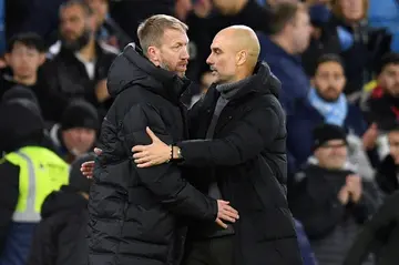 Chelsea boss Graham Potter (L) and Manchester City manager Pep Guardiola