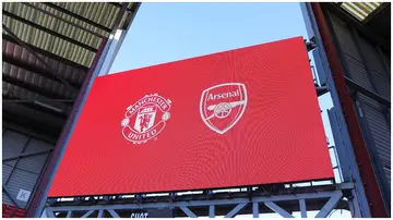 The Manchester United and Arsenal badges are displayed on the LED board prior to the FA Women's Super League clash bewteen the sides on April 19, 2023, at the Leigh Sports Village.