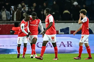 Folarin Balogun (2nd L) celebrates with teammates after scoring a last-gasp equaliser for Reims against Paris Saint-Germain