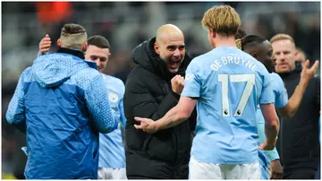 Pep Guardiola celebrates with Kevin De Bruyne after the Premier League match between Newcastle United and Manchester City at St. James Park. Photo by James Gill - Danehouse.