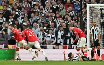 Manchester United's Casemiro (L) celebrates scoring against Newcastle