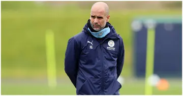Manchester City manager Pep Guardiola looks on during a training session at the City Football Academy. Photo by Martin Rickett.