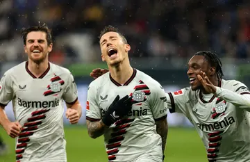 Bayer Leverkusen's Spanish defender #20 Alejandro Grimaldo (centre) now has five league goals since moving from Benfica in the summer
