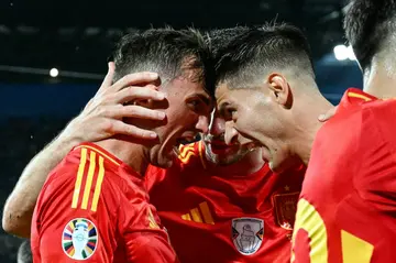Fabian Ruiz (L) celebrates with teammates after giving Spain the lead against Georgia