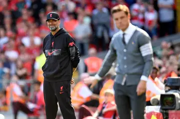 Liverpool manager Jurgen Klopp (L) says Scott Parker's (R) sacking as Bournemouth manager was unbelievable as he had not been given the funds he needed to strengthen the squad by the club owner