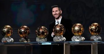 Lionel Messi poses with his Ballon d'Or awards. Photo: Getty Images.