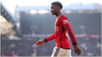 Kobbie Mainoo leaves the pitch during the Premier League match between Manchester United and Everton FC at Old Trafford. Photo by Alex Livesey.