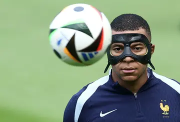 Kylian Mbappe sports a mask in training on Sunday. Could the France captain play against Poland on Tuesday?