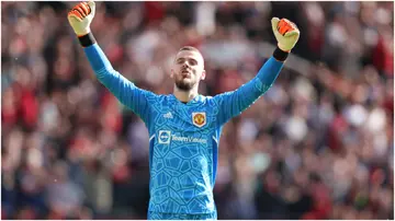 David de Gea celebrates Man United's 2-0 victory during the Premier League match between United and Wolves at Old Trafford. Photo by Matthew Ashton.