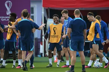 Raheem Sterling (centre) trains with England after returning to the team's World Cup base following a break-in at his home